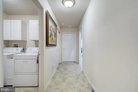 a bedroom with bed and a chandelier