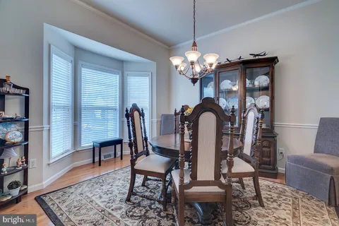 a kitchen with stainless steel appliances granite countertop a stove microwave and cabinets