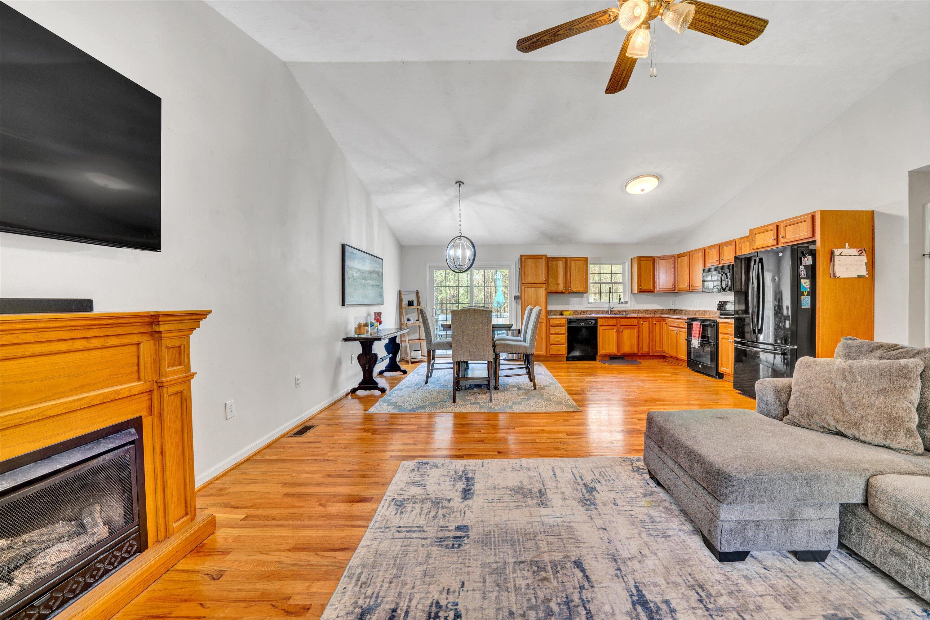 781 Holland Road Callaway, VA 24067 - Photo 11 of 42 a living room with furniture and a flat screen tv