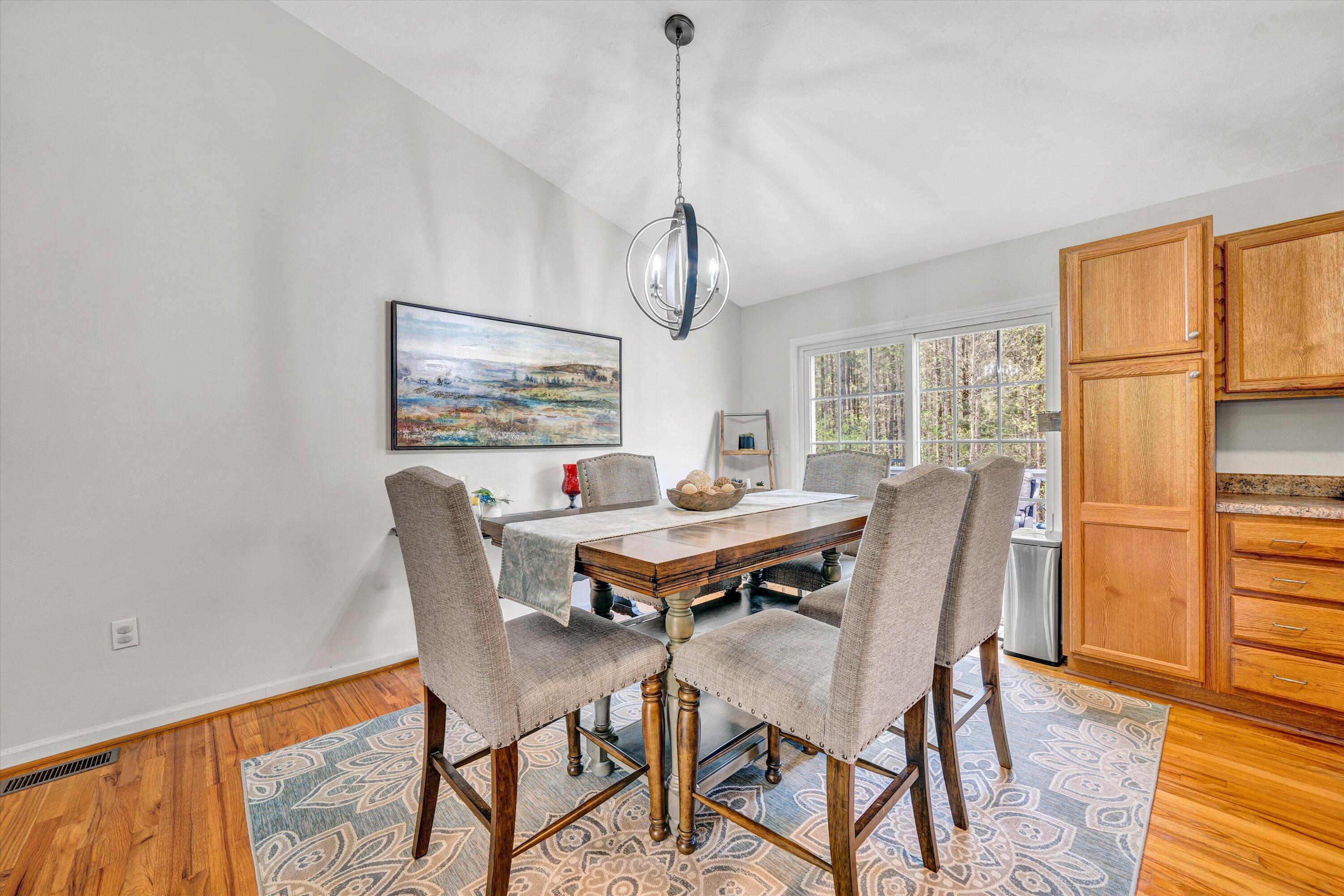 781 Holland Road Callaway, VA 24067 - Photo 13 of 42 a view of a dining room with furniture window and wooden floor