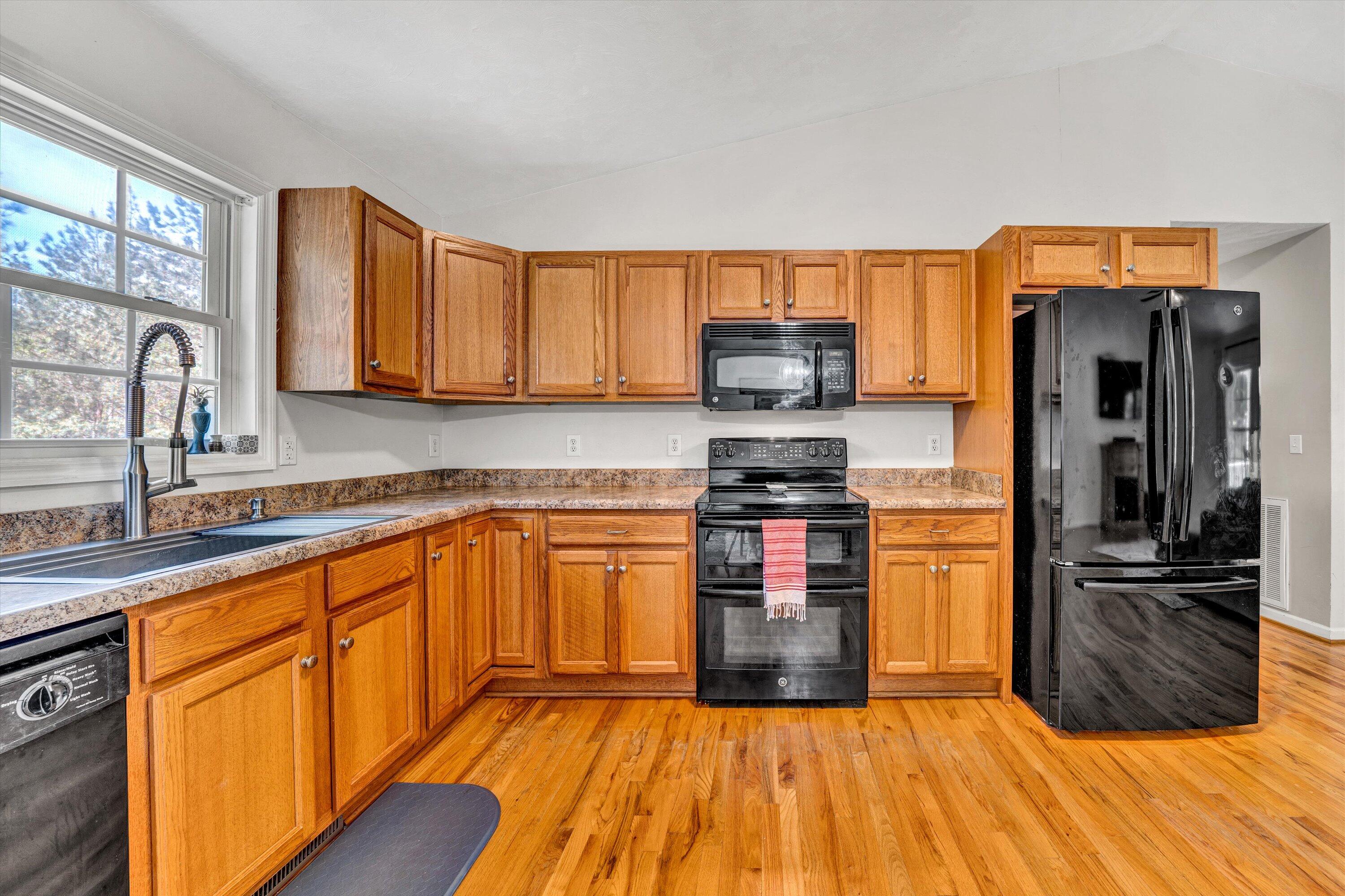 781 Holland Road Callaway, VA 24067 - Photo 15 of 42 a kitchen with stainless steel appliances granite countertop a refrigerator and a stove top oven