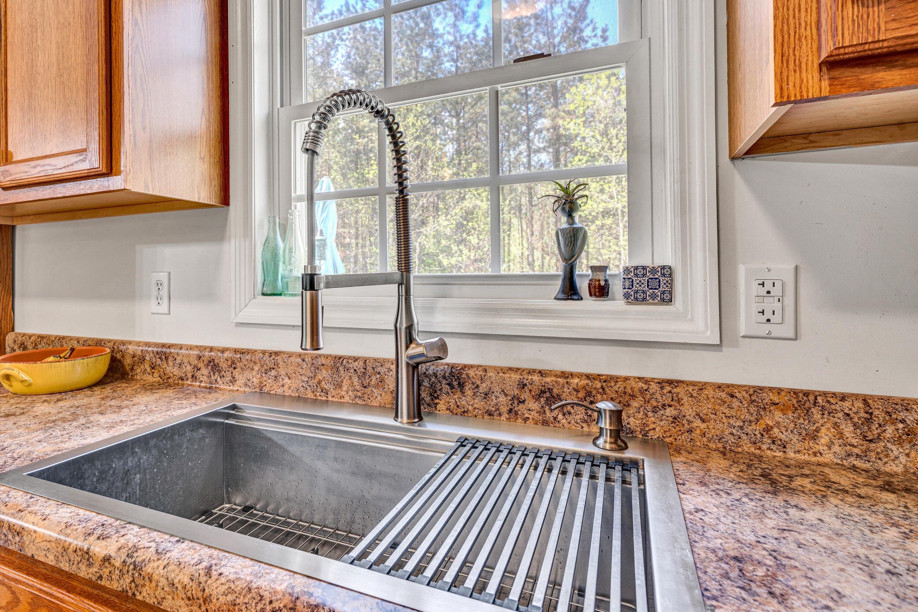 781 Holland Road Callaway, VA 24067 - Photo 16 of 42 a kitchen with a sink and a large window