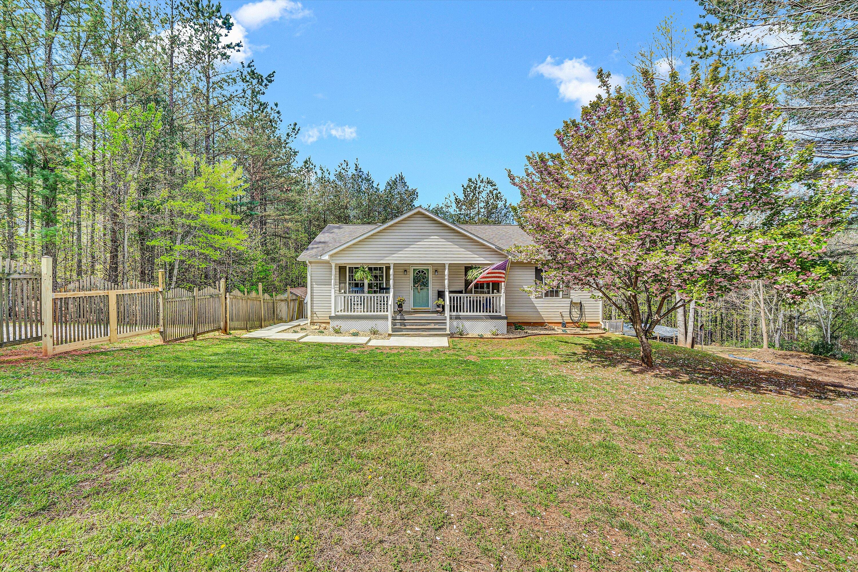 781 Holland Road Callaway, VA 24067 - Photo 2 of 42 a front view of a house with yard and green space