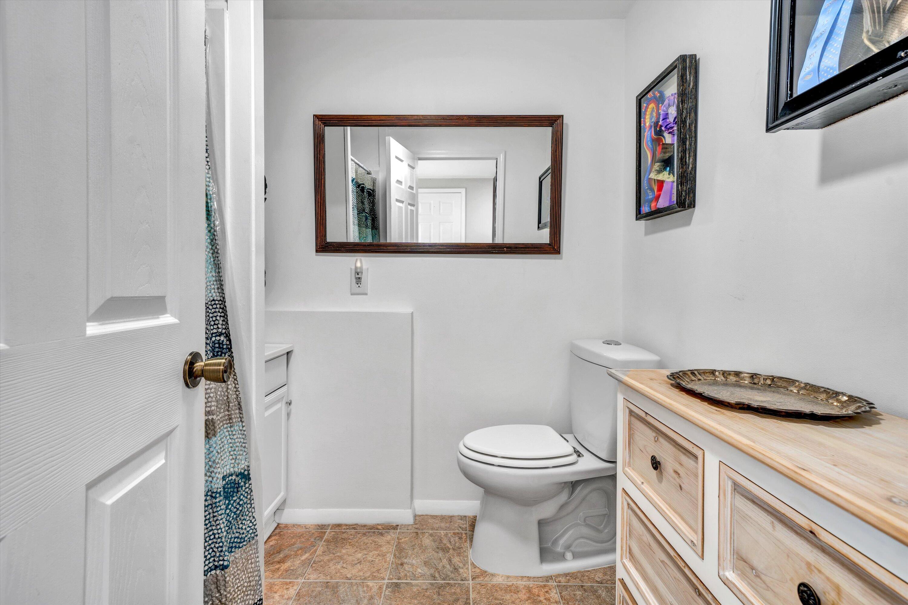 781 Holland Road Callaway, VA 24067 - Photo 30 of 42 a bathroom with a toilet a sink and mirror