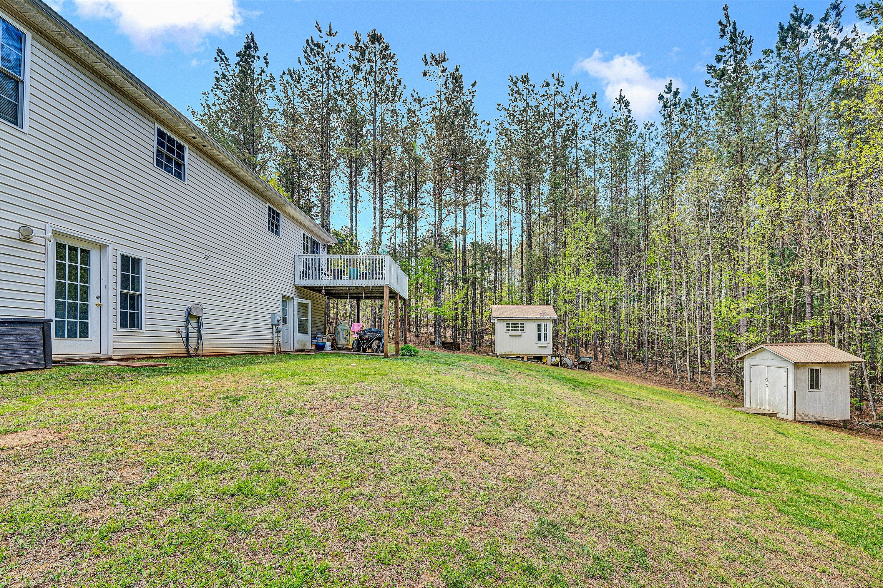 781 Holland Road Callaway, VA 24067 - Photo 32 of 42 a house with trees in the background