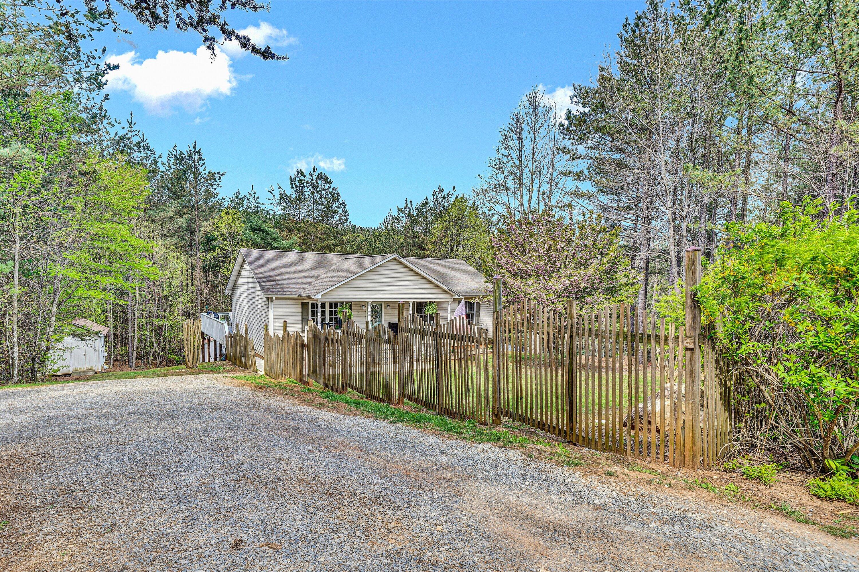 781 Holland Road Callaway, VA 24067 - Photo 38 of 42 a view of a house with a big yard and large trees