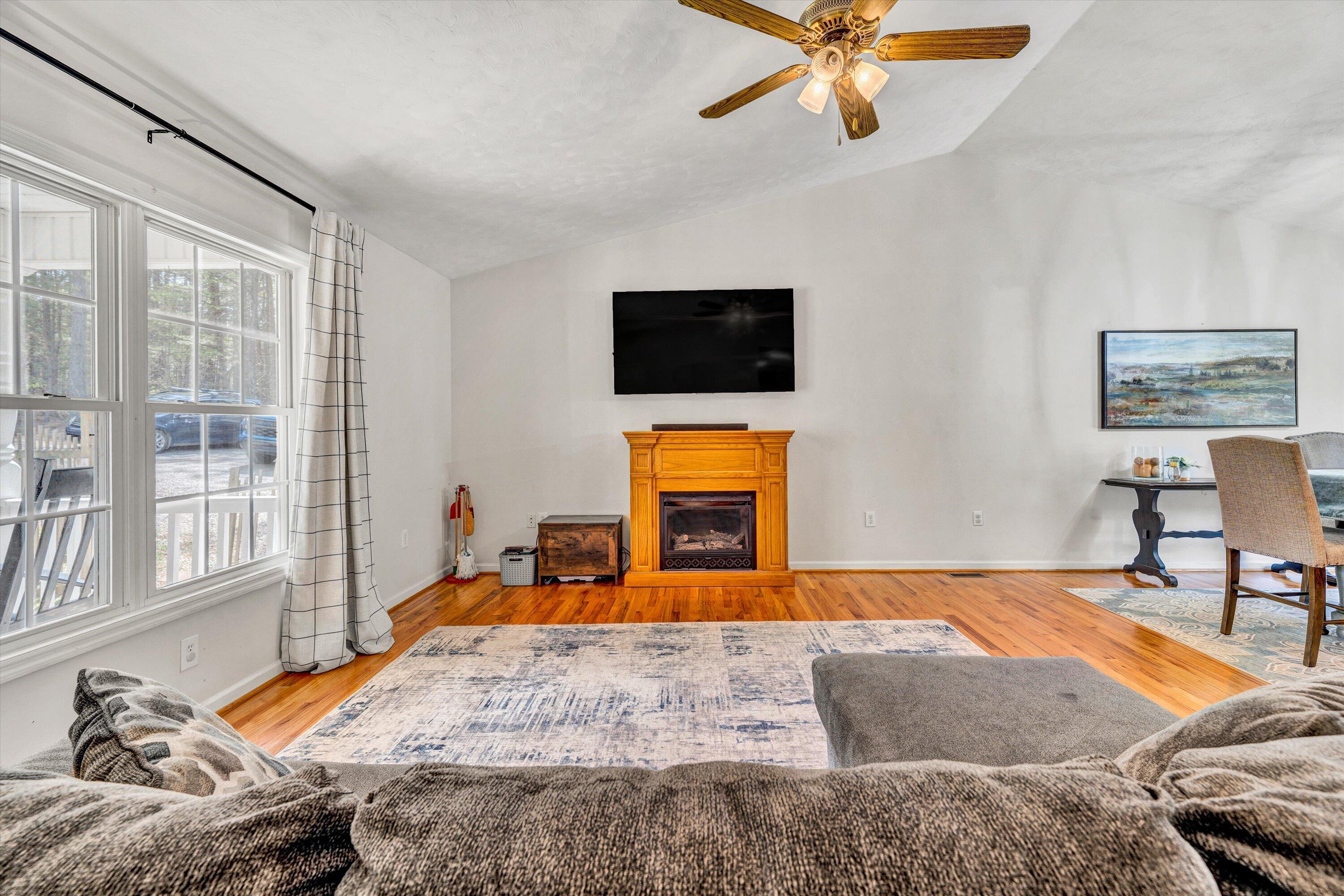 781 Holland Road Callaway, VA 24067 - Photo 7 of 42 a bedroom with a bed and a flat screen tv