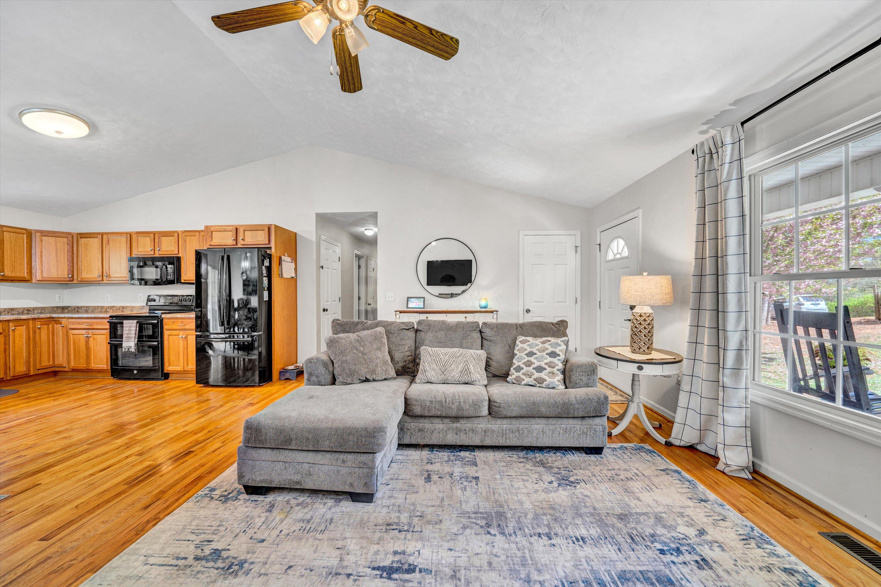 781 Holland Road Callaway, VA 24067 - Photo 10 of 42 a living room with furniture and a flat screen tv
