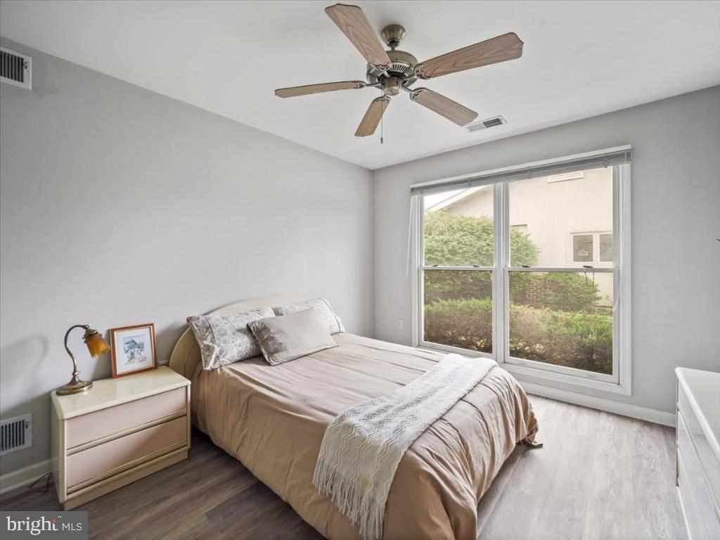 169 Arrowhead Loop Hedgesville, WV 25427 - Photo 11 of 24 a bedroom with a bed wooden floor and window