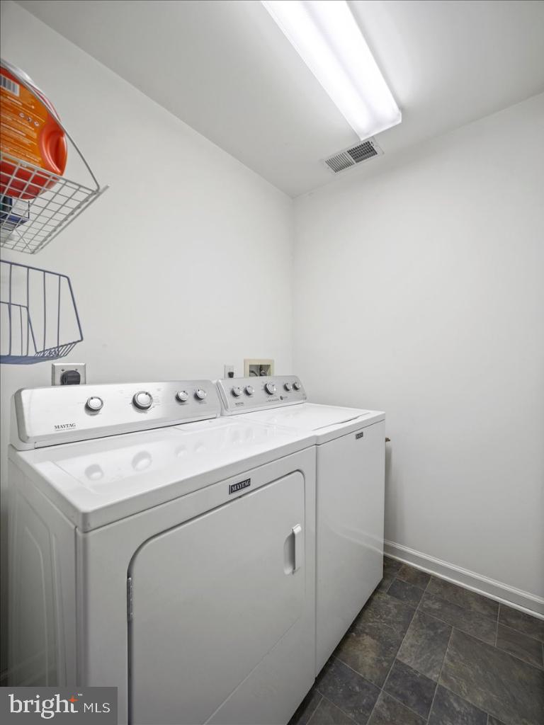 169 Arrowhead Loop Hedgesville, WV 25427 - Photo 13 of 24 a utility room with dryer and washer