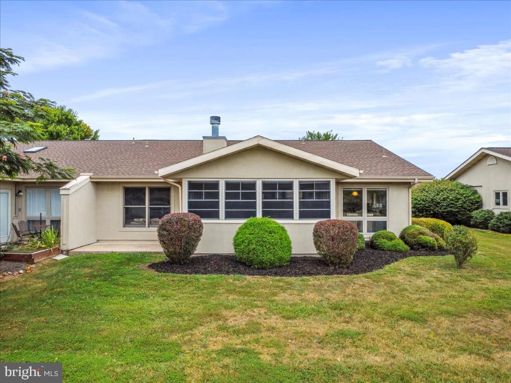 169 Arrowhead Loop Hedgesville, WV 25427 - Photo 16 of 24 a front view of a house with garden