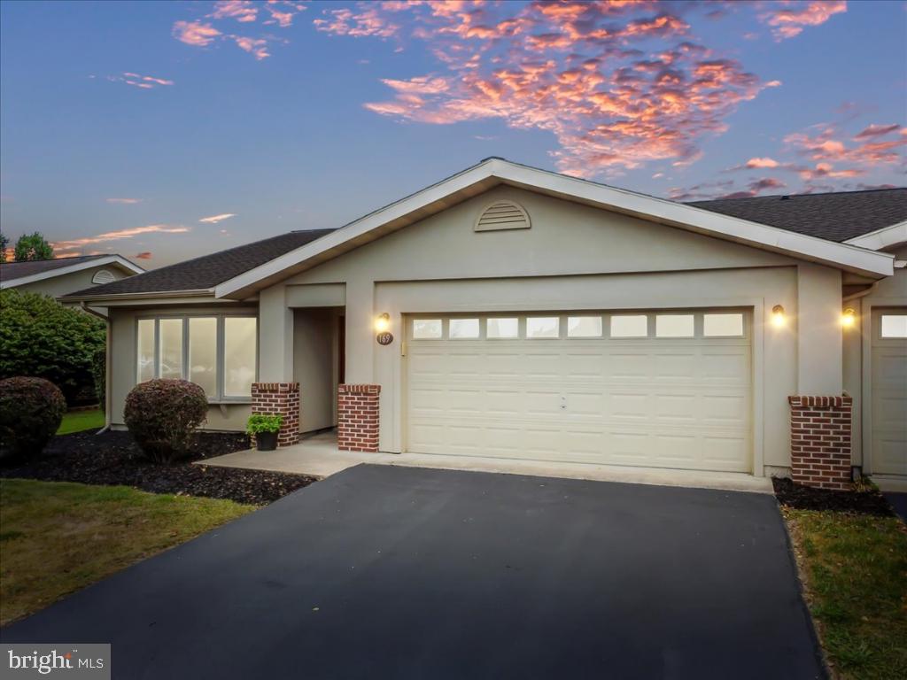 169 Arrowhead Loop Hedgesville, WV 25427 - Photo 24 of 24 a front view of a house with garden