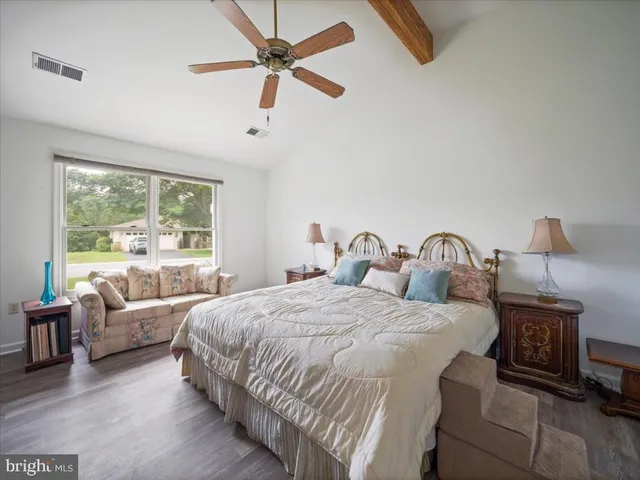 a bedroom with bed and window