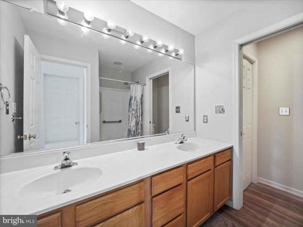 169 Arrowhead Loop Hedgesville, WV 25427 - Photo 10 of 24 a bathroom with double vanity sinks and a mirror