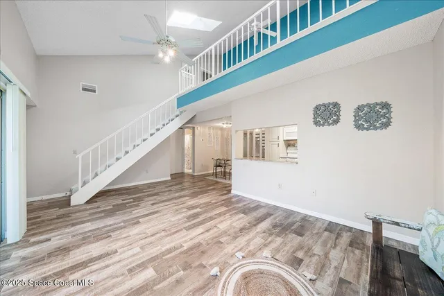 a view of an empty room with windows