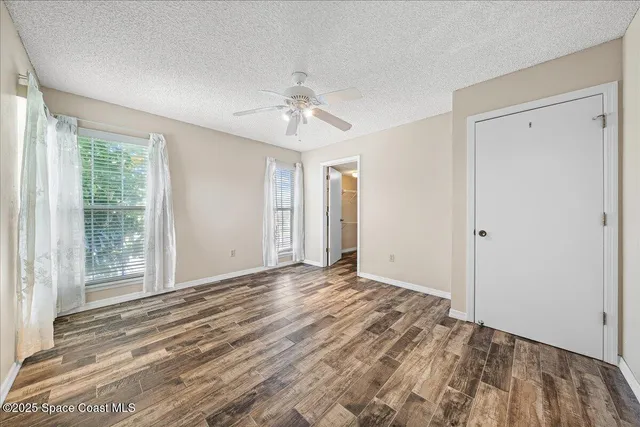 a view of a lake with a house in the background