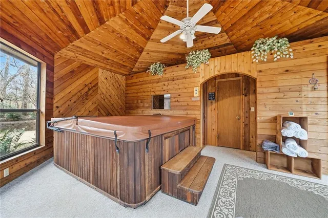 a view of a porch with furniture and front door