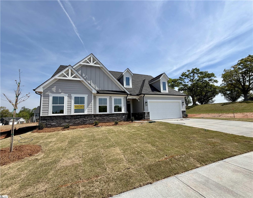 This newly constructed residence offers curb appeal and a spacious lot.
