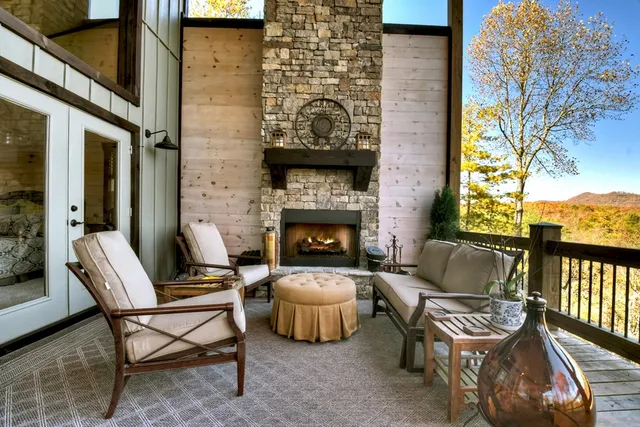 a view of a roof deck with table and chairs and wooden floor