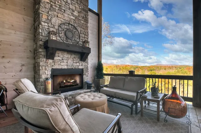 a spacious bedroom with a bed and a flat screen tv