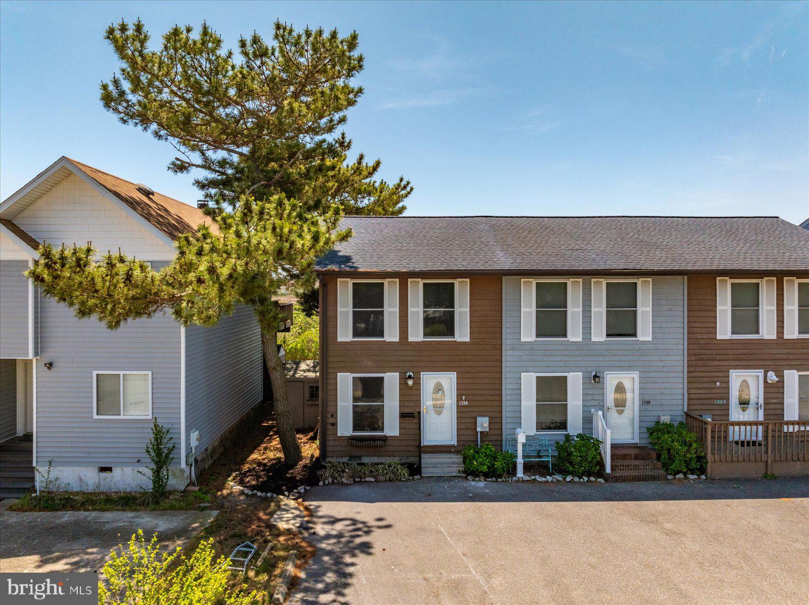 135 Jamestown Road, Unit 18A Ocean City, MD 21842 - Photo 51 of 63 a front view of a house with garden