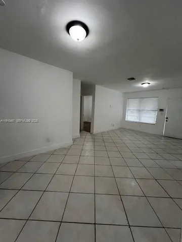 a view of an empty room and window