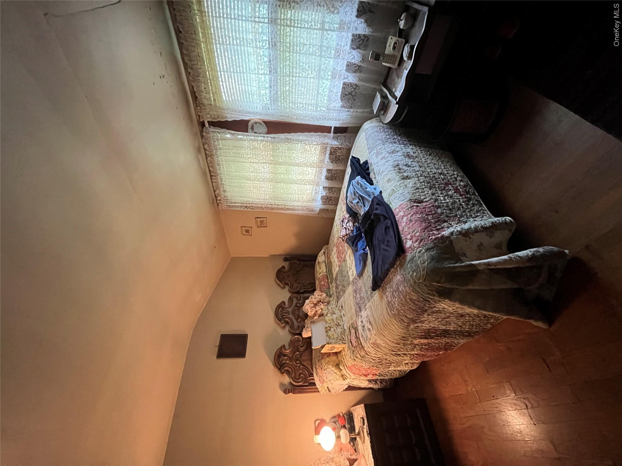 35 Spring Street Goshen, NY 10924 - Photo 20 of 26 a bedroom with a bed and window