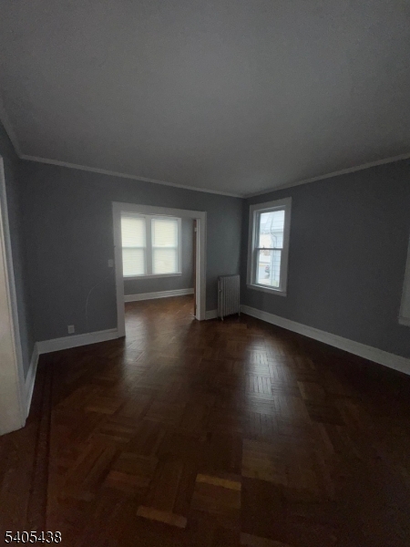 742 Pennington Street Elizabeth, NJ 07202 - Photo 5 of 11 a view of wooden floor and windows in a room