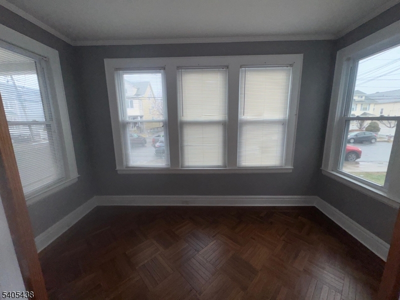 742 Pennington Street Elizabeth, NJ 07202 - Photo 10 of 11 a view of wooden floor in an empty room with a window