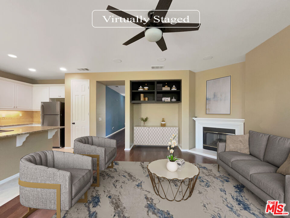 24025 Via Sereno Valencia, CA 91354 - Photo 2 of 27 a living room with furniture and a fireplace