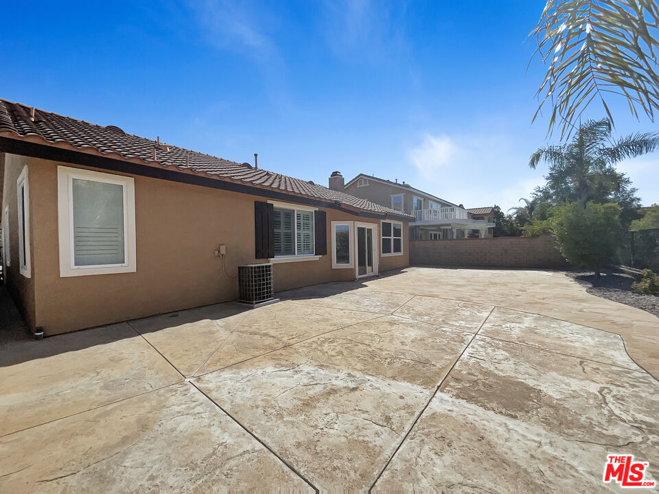 24025 Via Sereno Valencia, CA 91354 - Photo 26 of 27 a backyard of a house with large trees