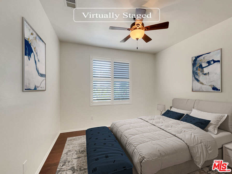 24025 Via Sereno Valencia, CA 91354 - Photo 4 of 27 a bedroom with a large bed and a chandelier