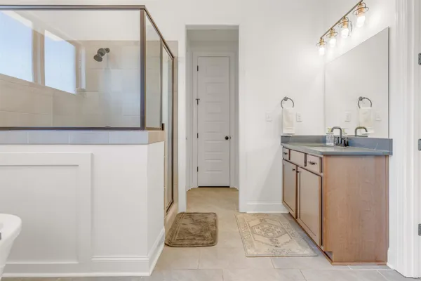 a bathroom with a sink and mirror