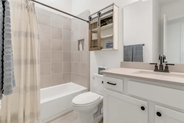 a bathroom with a sink a toilet and a bathtub