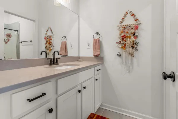 a bathroom with a sink and mirror