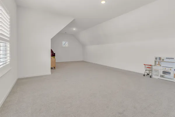 an empty room with a empty space and a window