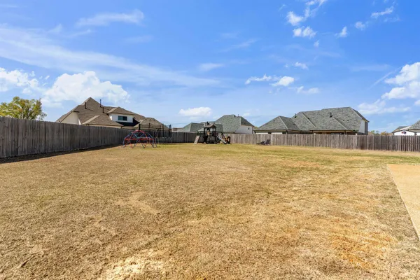 a view of a lake with a house in the background
