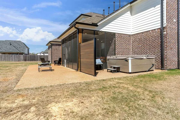 a view of a white house with a outdoor space