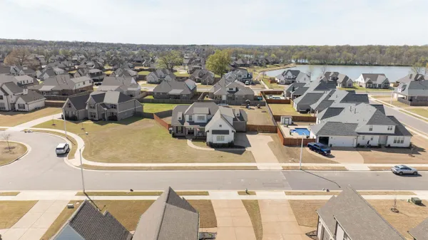 an aerial view of a house with a swimming pool
