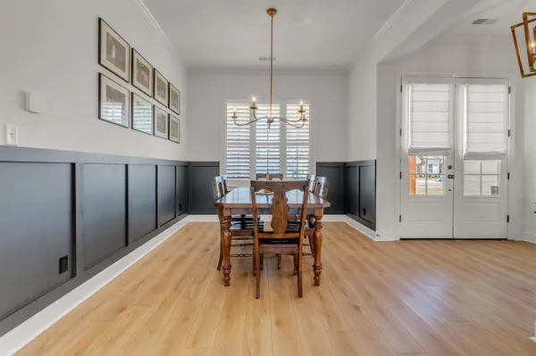 a workspace with furniture window and wooden floor