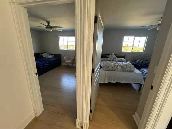 wooden floor in an empty room with stairs