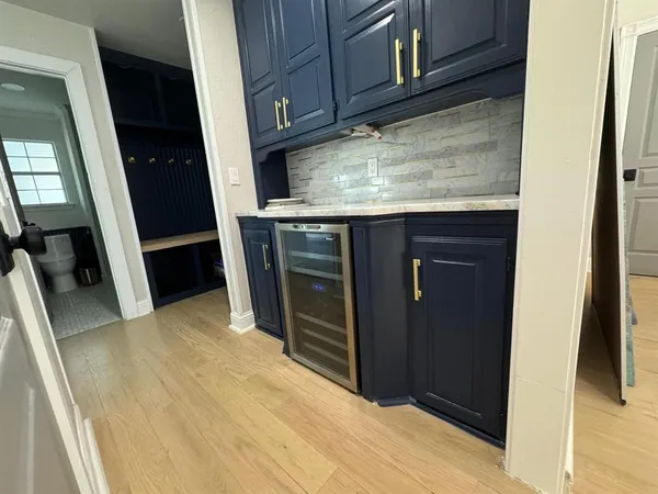 a living room with furniture and a lamp