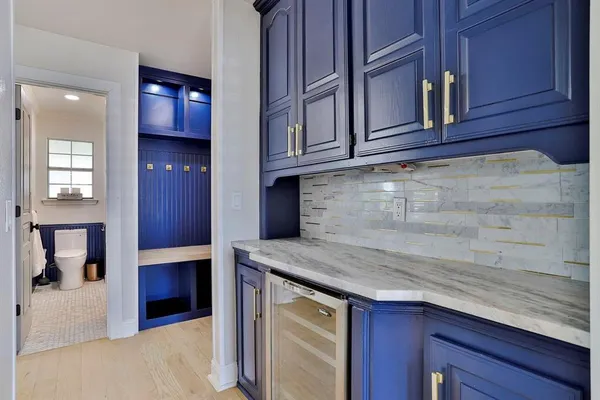 a kitchen with stainless steel appliances granite countertop cabinets and window