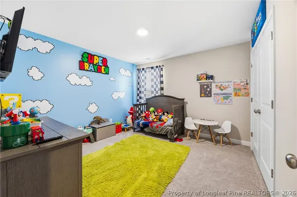 a bed room with a bed and a couch