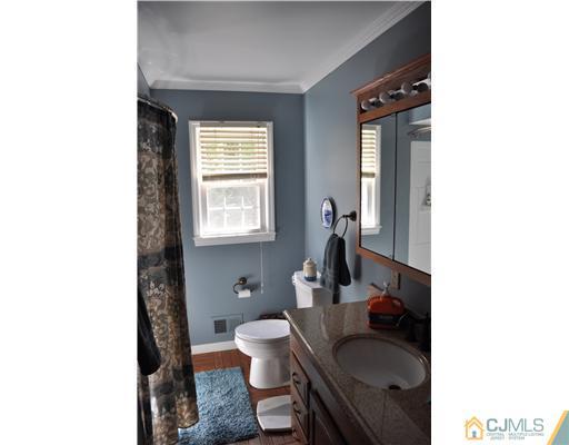 64 Ridge Road Edison, NJ 08817 - Photo 11 of 22 a living room with furniture and a window