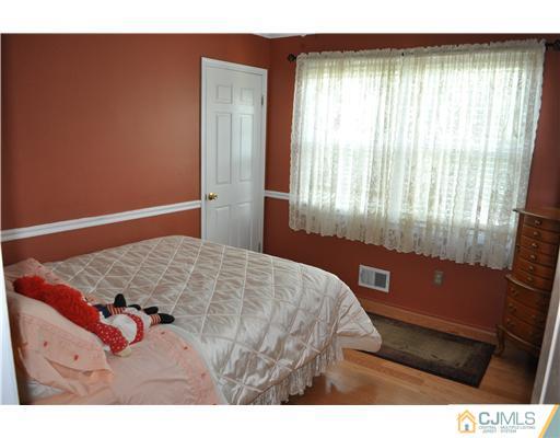 64 Ridge Road Edison, NJ 08817 - Photo 13 of 22 a bedroom with a bed and a window