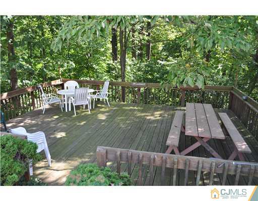 64 Ridge Road Edison, NJ 08817 - Photo 17 of 22 a view of a chairs and table on the patio