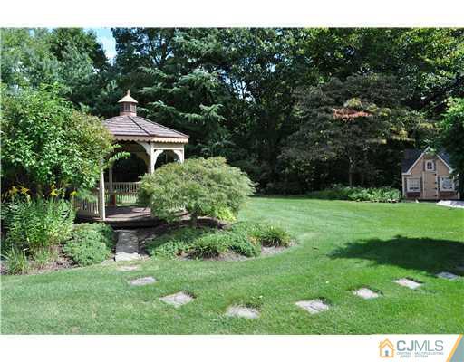 64 Ridge Road Edison, NJ 08817 - Photo 19 of 22 a front view of a house with a yard