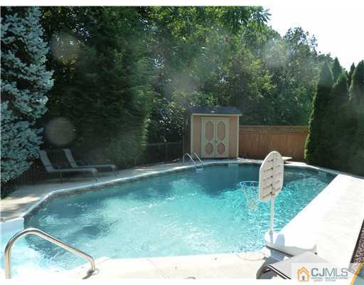 64 Ridge Road Edison, NJ 08817 - Photo 21 of 22 a backyard of a house with lots of green space