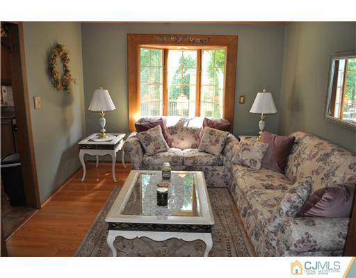 64 Ridge Road Edison, NJ 08817 - Photo 4 of 22 a living room with furniture and a window